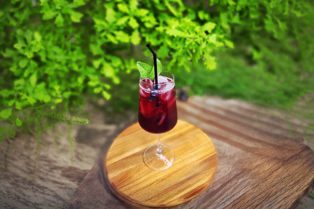 Fresh berry drink at a nature camping destination